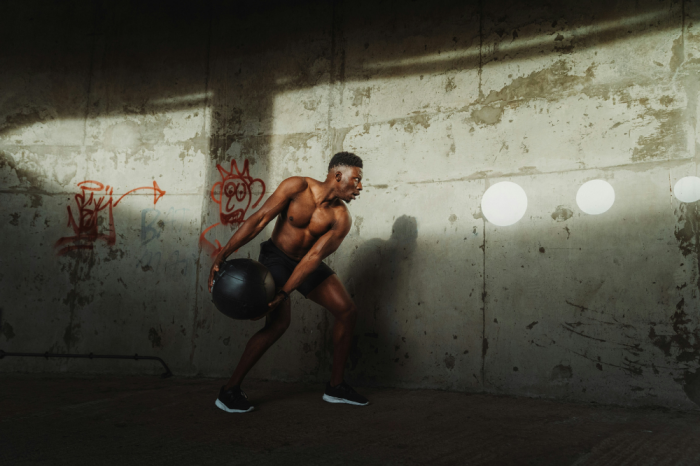 A man working out with a medicine ball